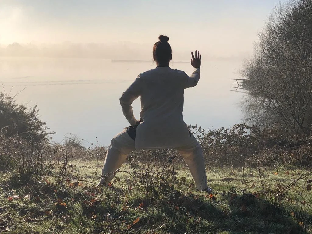 Qigong in front of lake